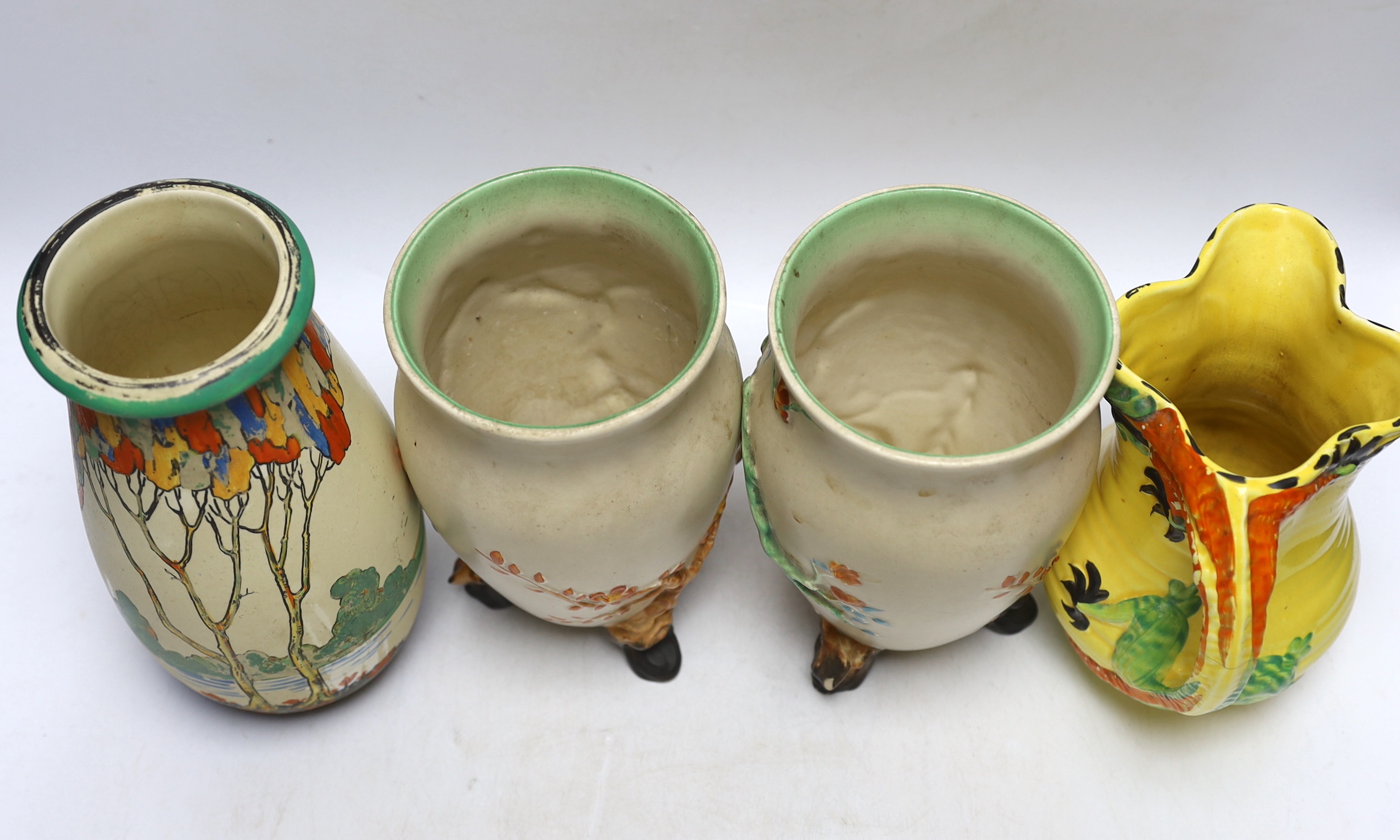 A pair of Clarice Cliff pottery vases, Ducal vase and a jug, largest 23cm high